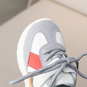 Detailed close-up of multi-color children sneaker head with high-quality stitching and laces
