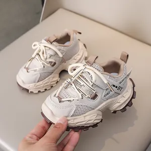 Detailed close-up of kids' breathable chunky sneakers with mesh and faux leather patches