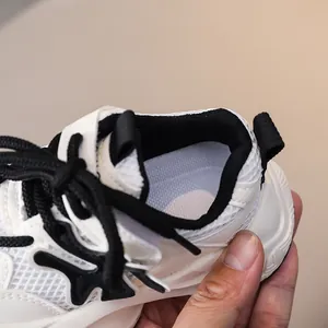 Detail of breathable mesh lining and padded heel collar on children sneakers