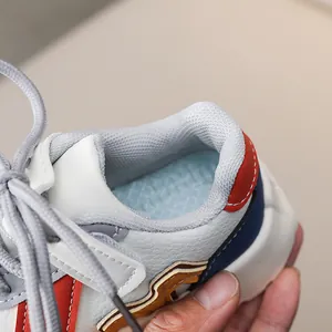 Detailed close-up of multi-colored kids sneakers with breathable mesh lining and quality stitching