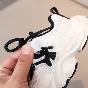 Detail of the easy hook-and-loop closure on breathable mesh kids' running sneakers