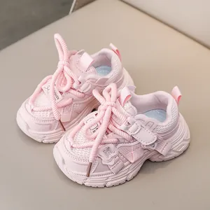 Pink mesh running sneakers for little girls featuring glitter butterfly wing details
