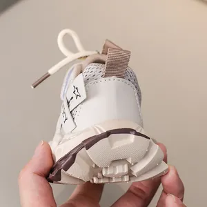 Detail of children's mesh sneakers featuring non-slip rubber soles and breathable fabrics