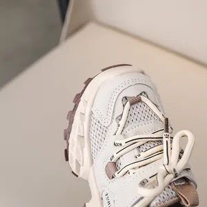 Detailed close-up of kids breathable mesh sports shoes with non-slip thick rubber soles
