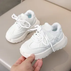 Classic white children's leather sneakers with velcro straps and anti-slip thick soles