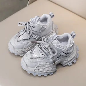 Grey chunky breathable mesh sneakers for kids with durable non-slip soles and 1982 logo