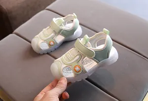 Detail of kids spider-themed sandals with breathable mesh and protective closed toe