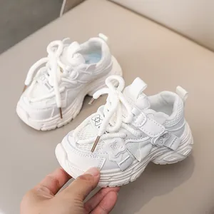 White chunky mesh running shoes for girls featuring a 3D butterfly patch and velcro strap