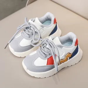 Children's white leather sneakers with orange wave detail and gray-red contrast