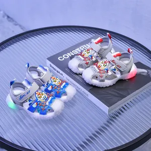 Kids LED light-up sandals featuring superhero motifs and soft glowing rubber soles