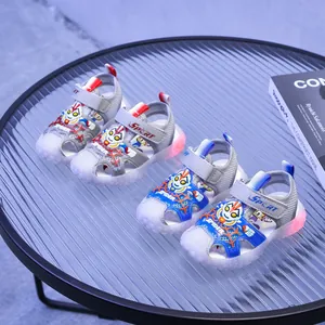 Kids LED light-up sandals with cartoon hero motifs and breathable mesh in blue and grey