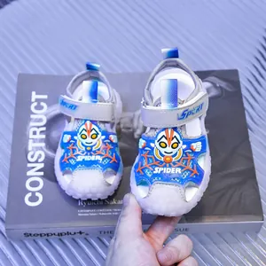 Detail of kids sport sandals featuring a closed-toe design with superhero themed patterns