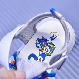 Close-up of children's sport sandals with breathable mesh and Ultraman printed insoles