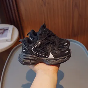 Kids breathable black mesh sneakers with white wavy side stripes and thick cushioned soles