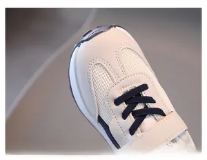 Detailed close-up of breathable mesh upper and reinforced toe on kids sneakers