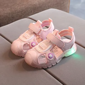 Pink kids breathable mesh sports sandals with closed toe and green LED light-up soles