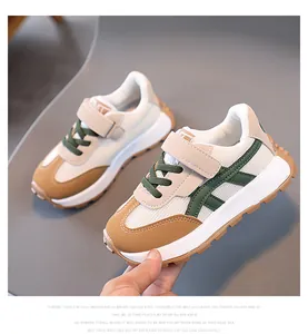Detail of children sneakers with breathable mesh, velcro strap and non-slip rubber sole