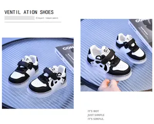 Close-up of kids' panda sneakers with ventilation holes and dual hook-and-loop closure
