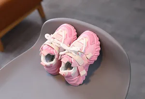 Detailed side view of pink children's chunky sneakers with thick anti-slip soles