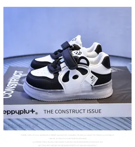 Detail of baby panda sneakers with leather upper and non-slip rubber soles in close-up
