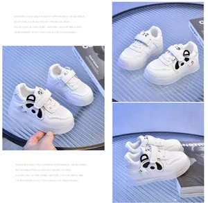 Detail of white toddler sneakers with cute panda pattern and dual velcro strap closure