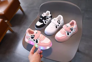 Close-up of pink panda themed toddler sneakers with colorful LED light-up translucent sole