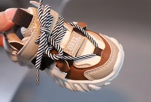 Detail of kids vintage platform sneakers showing textured stitching and velcro strap