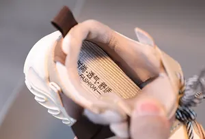 Close-up of the breathable mesh insole with comfort fashion lettering inside the shoe