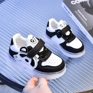 Close-up of panda cartoon infant sneakers featuring Velcro straps and non-slip thick soles