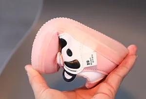 Close-up of flexible pink panda sneakers showing high sole flexibility for kids