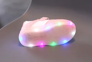 Detail of pink LED light-up sneakers for kids showing glowing multi-color soles and velcro