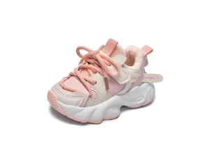 Detail view of pink and white kids sneakers with warm fleece lining and 1989 ribbon