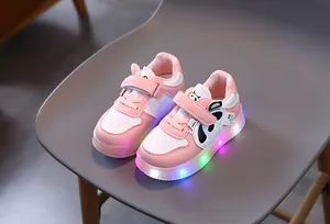 Detail of toddler panda sneakers with flashing multi-color LED lights and pink accents