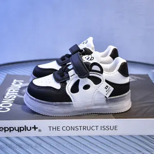 Detail view of toddler panda sneakers with velcro straps and durable rubber soles