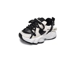 Detail of children's fleece-lined chunky sneakers with black and white mesh leather