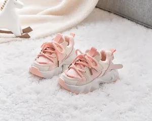 Detail of warm white fleece lining inside pink and beige winter sneakers for kids