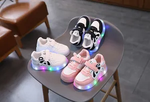Three colors of kids LED glowing sneakers featuring cute panda cartoon designs and velcro