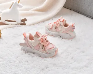 Detail view of pink and beige kids fleece-lined sneakers with warm plush interior