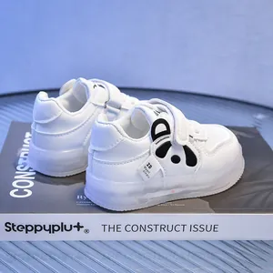 Detail of white toddler LED light-up shoe with panda motif and velcro strap closure