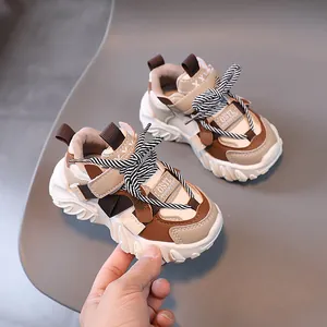 Kids chunky fashion sneakers in beige and brown with thick sole and stylish laces