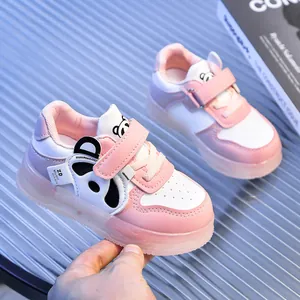 Close-up of pink toddler sneakers with cute panda patch and soft non-slip sole