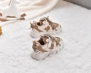 Close-up of children's warm fleece lining and sturdy velcro strap on winter sneakers