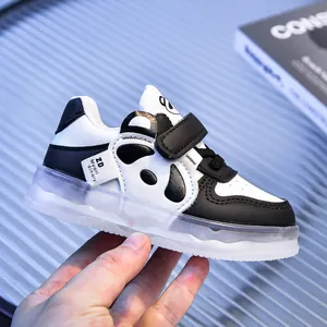 Detail of toddler sneakers with cute panda design and translucent non-slip rubber sole