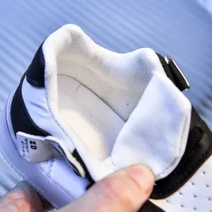 Macro detail of breathable mesh lining and cushioned heel padding for toddler sneakers