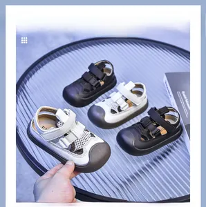 Detail of breathable hollow mesh sandals for kids with protective toe cap and velcro straps