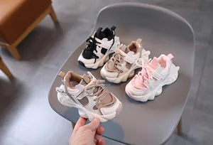 Close-up of winter kids sneakers featuring thick soles and breathable mesh materials