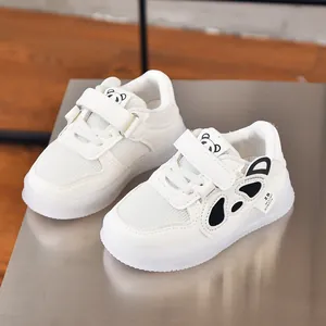 Detail view of white toddler sneakers featuring panda ears and breathable mesh upper