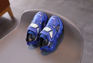 Detail of royal blue racing-car themed kids light-up sneakers with velcro closure