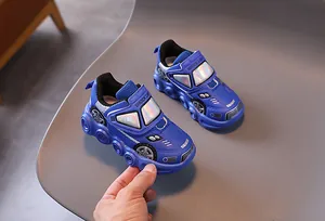Detail view of blue racing car style kids sneakers with LED lights and velcro straps