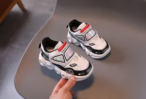 Detail view of racing car style kids sneaker with SHOCK LIGHT strap and grippy gear sole